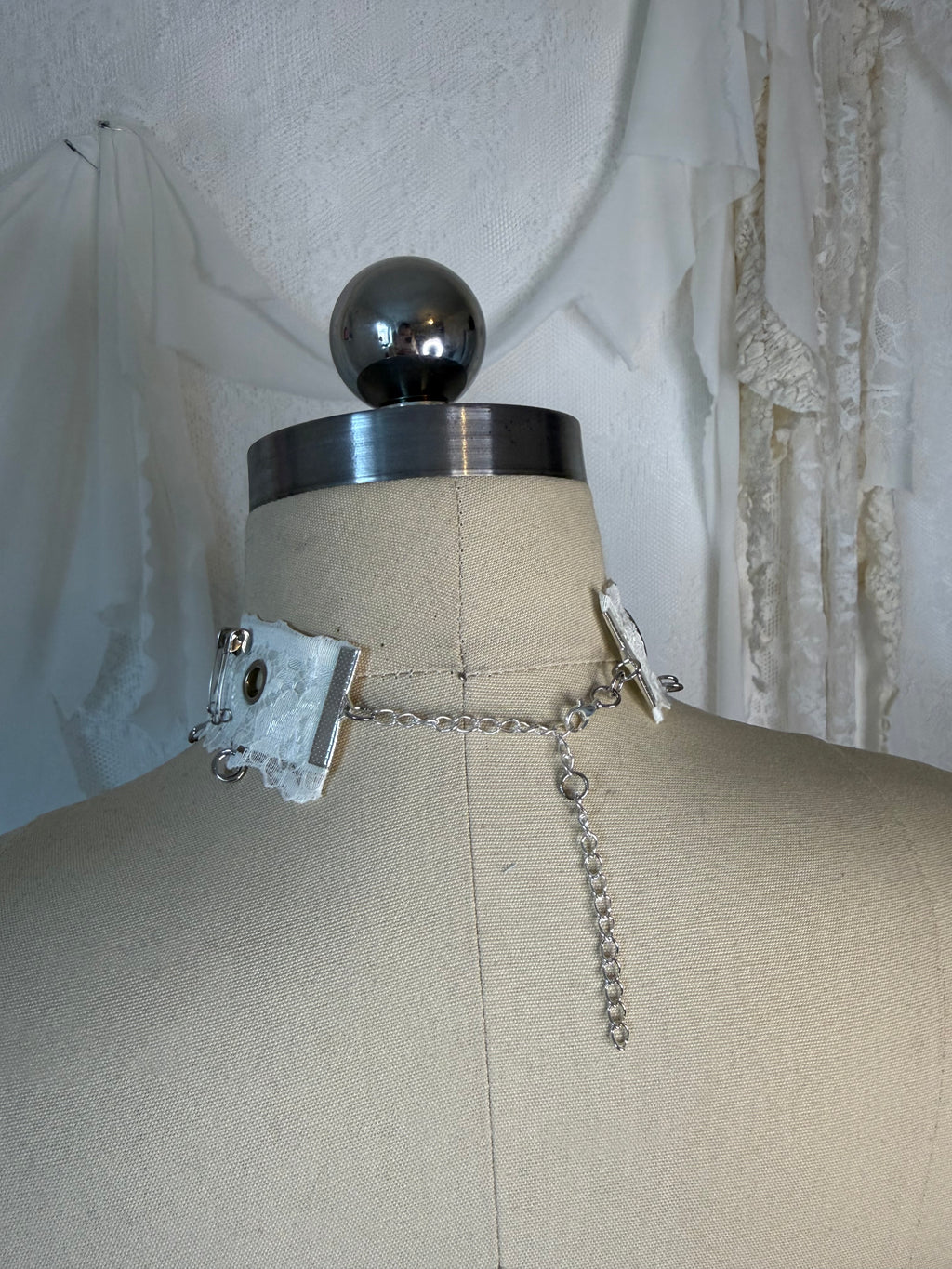 Lace choker with metal accessories