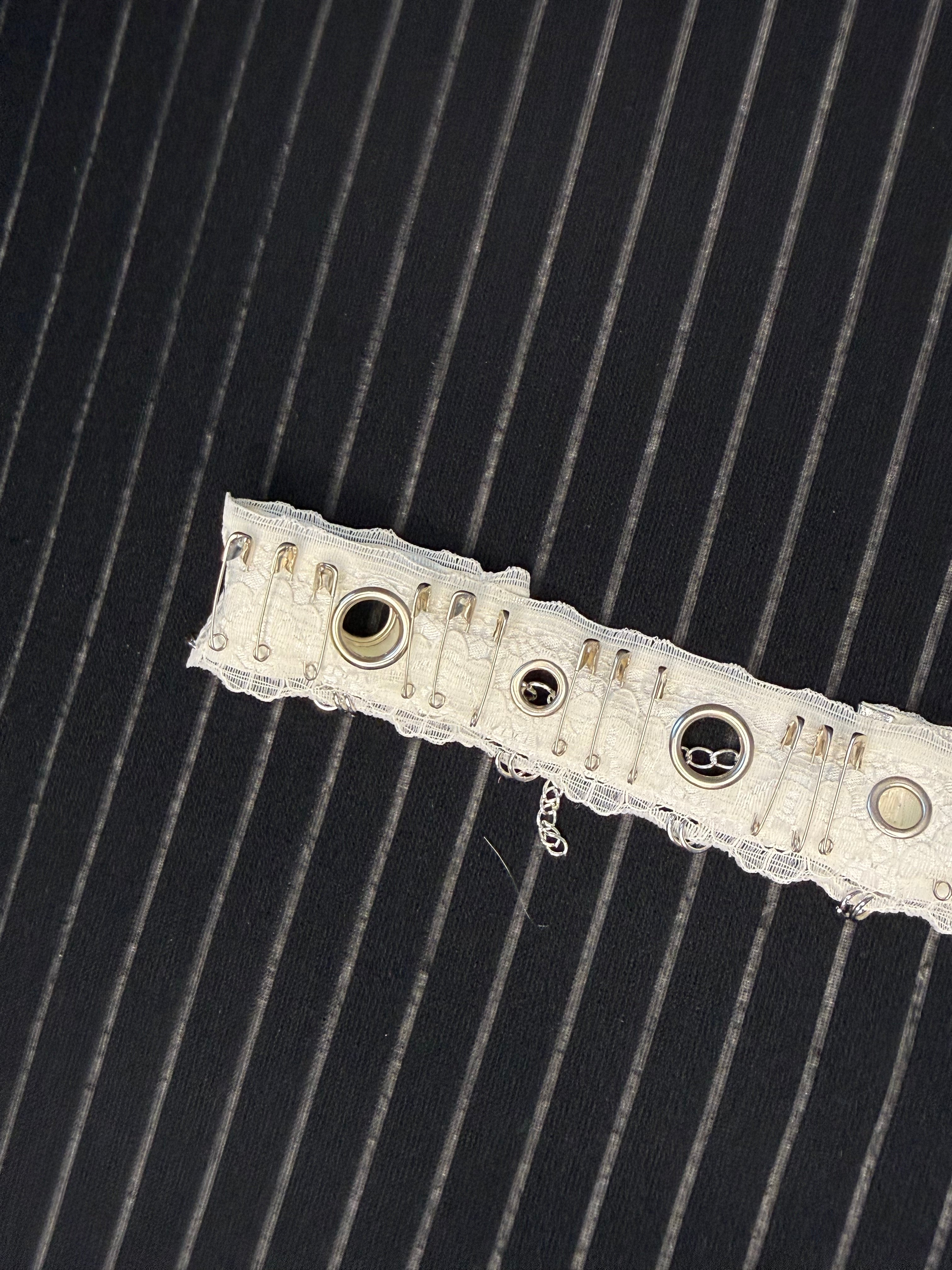 Lace choker with metal accessories